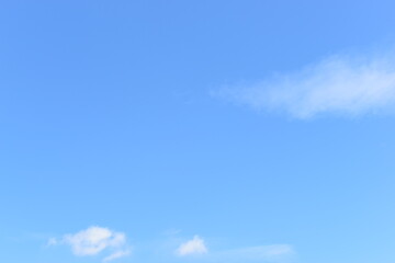 beautiful blue sky and white fluffy group of clouds with sunrise in the morning, natural background