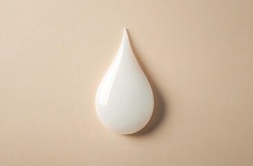 Creamy, smooth, liquid drop on beige background. Detailed close-up of a white serum or lotion, perfectly shaped like a teardrop. Smooth texture is highlighted