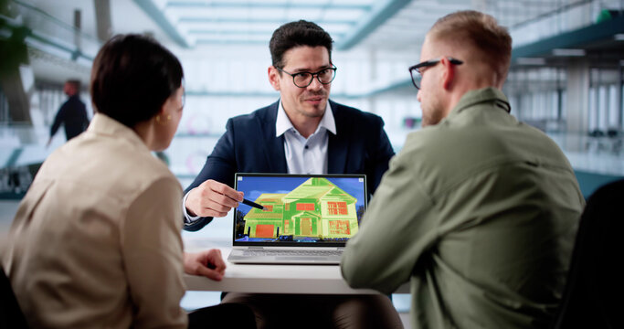 Professional House Inspector Using Heat Thermography On Laptop