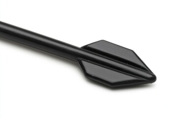 Close-up of a sleek, black arrowhead.  Sharp, pointed tip