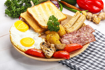 English breakfast with toast, egg and sausages