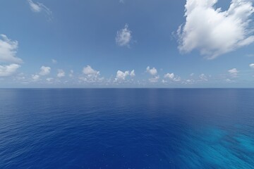 Obraz premium Serene ocean view under a mostly clear blue sky, with scattered fluffy white clouds