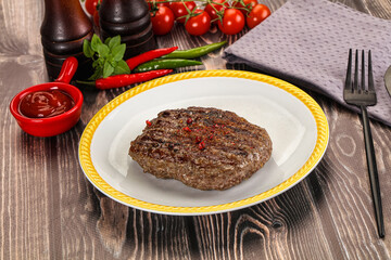 Grilled beef burger cutlet with sauce