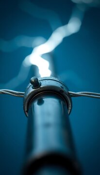 close up of a metal pole with a blue background
