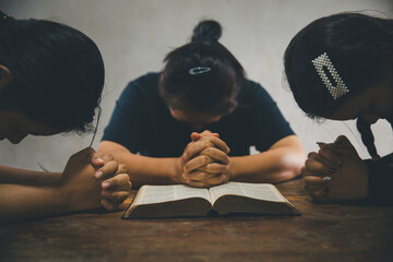 Praying religion, worship and group of people pray to God, Family, holding hands and prayer in home...
