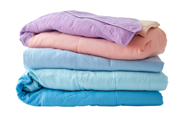 Stack of pastel blankets soft colors cozy bedding home textiles