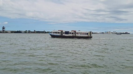 A video of water bus or water taxi departing from Kochi Water Metro station during the day