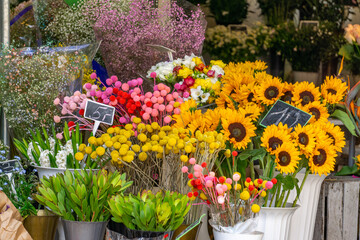 richly decorated stall with a variety of flowers, including sunflowers, crimson, gypsophila and...