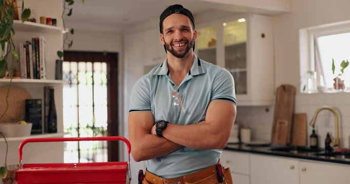 Happy man, plumber and kitchen with confidence for water damage, piping renovation or home leak. Portrait, male person or repairman with smile or arms crossed for professional house fix or call out