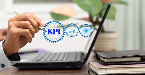Businessman write KPI word at workplace in office, Key Performance indicator