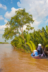 Fisherman is fishing in Mekong river in the morning - People boating in the delta of Mekong river, Vietnam, Asia