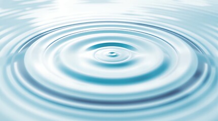 Rippling concentric circles expand serene light blue water surface calm