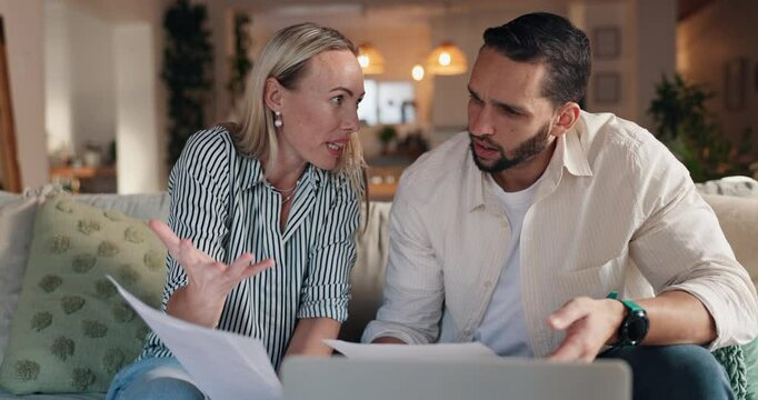 Frustrated couple, finance and documents with laptop on sofa at night for debt, high mortgage or bills. Man, woman or discussion with paperwork on computer for financial crisis or online expenses