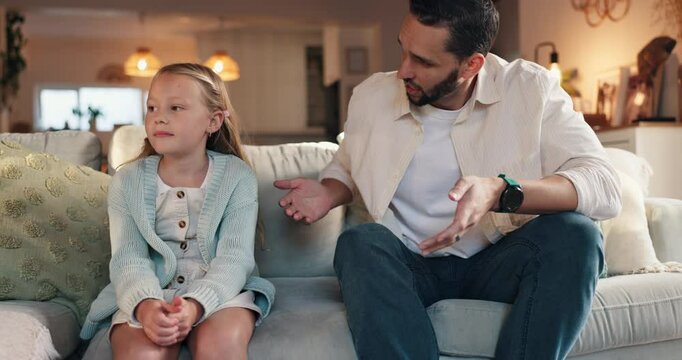 Discipline, father and talking to child on sofa for bad behavior, attitude problem and punishment for tantrum. Lesson, man and reprimand girl kid in home with discussion, teaching manners and advice