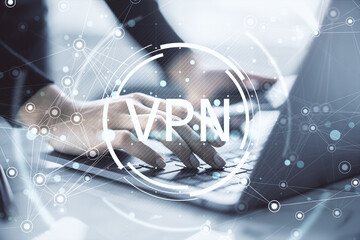 Hands typing on laptop with VPN text overlay and digital connection network on light abstract background representing cybersecurity concept.
