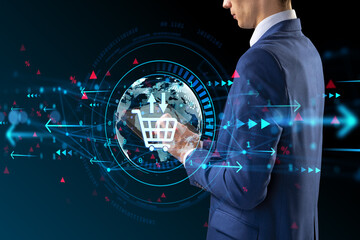 Businessman using tablet with digital ecommerce interface and glowing global network hologram overlay on dark background in futuristic style.