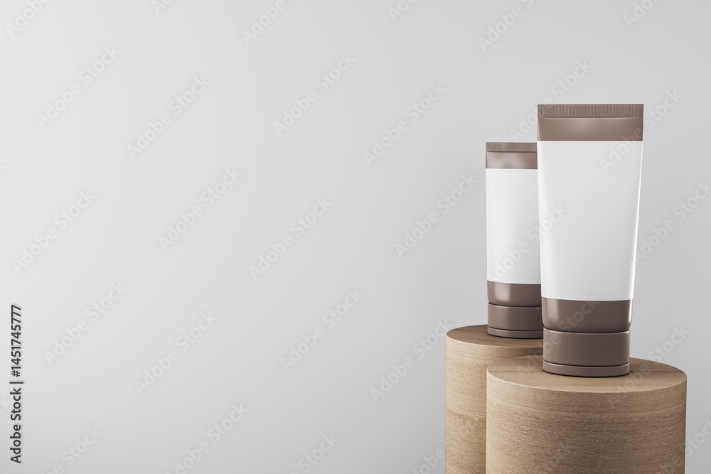 Aufkleber Cosmetic tubes with blank labels on wooden podiums against clean light background for product presentation and branding mockup template stage placement. 3D Rendering