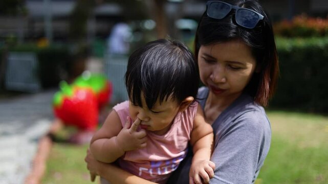 Mother And Toddler In Arms, Video footage for documentary and cinematic in travel scene.