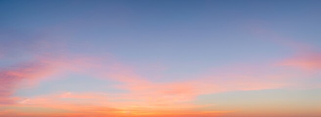 Sky with clouds at sunset or sunrise; colors of orange pink and blue. luxury premium real sunset and sunrise photo collection for background