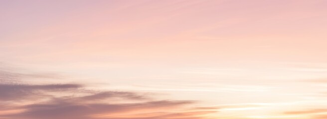 Soft pastel sky with clouds showing pink orange and yellow hues. luxury premium real sunset and sunrise photo collection for background