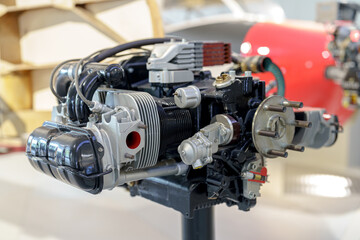Detailed view of a small aircraft engine showcasing innovative design and engineering at an aviation exhibition in 2023