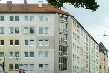 Urban apartment building with modern design in a city neighborhood during an overcast day