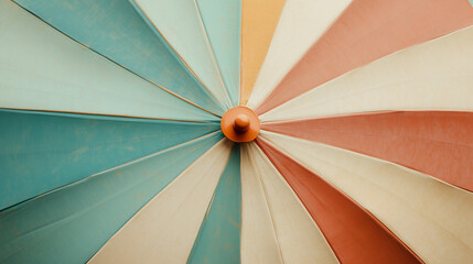 Colorful striped patio umbrella creates shade at outdoor cafe during sunny afternoon gathering
