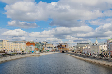 Moscow, Russia - April 4, 2025: View of the Moskva River. Kadashevskaya Embankment and Luzhkov Bridge.
