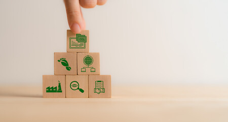 Carbon Data Open Protocol (CDOP) concept. Wooden blocks icons representing CO2 tracking,...