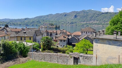 Orta San Giulio historic center with view on the island of San Giulio, province of Novara, Italy, May 2025.