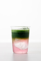 fresh matcha tea, green tea and coconut water on white wooden background.