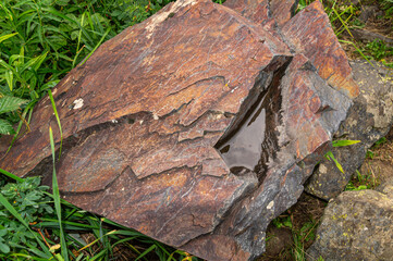 The surface of the rock. The surface of natural hard stone. Rocks in the mountains. Rocks, minerals, and minerals.