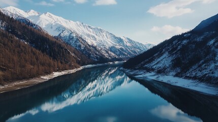 Fototapeta premium Snow-capped mountains, reflecting in a serene lake