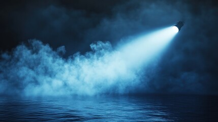 Obraz premium Foggy night scene with spotlight over water