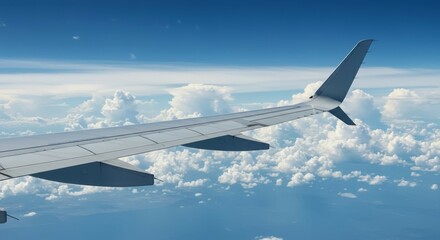 Obraz premium Flying Above Clouds Airplane Wing View of Sky