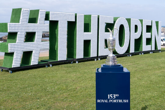 Portrush, Northern Ireland - May 2nd, 2025: The Claret Jug Open Golf Championship silver trophy on blue stand part of promotion for 153rd tournament to be held at Royal Portrush Golf Club.