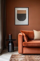 Contemporary living room featuring a rich terracotta color palette.  A geometric abstract print hangs above a plush velvet sectional sofa. A simple, dark round side table anchors the scene