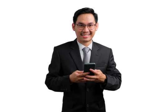 Young Asian businessman in black suit holding smartphone and smiling isolated on transparent background