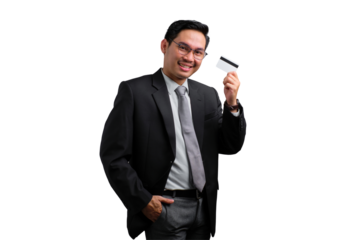 Confident young Asian businessman holding credit card and smiling isolated on transparent background