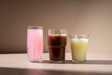 Different protein shake drinks in glasses 