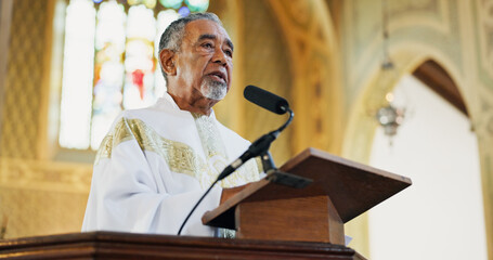 Christianity, pastor and preaching in church, religion and praying with microphone for faith or...