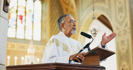 Worship, pastor and praying in church, faith and preaching with microphone for Christianity or...