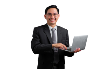 Confident young Asian businessman in black suit working on laptop isolated on transparent background
