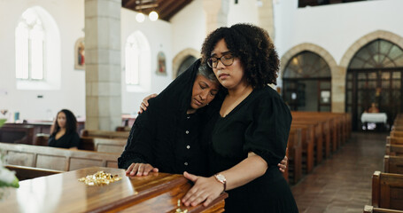 Sad, hug and family with support in funeral for farewell service, mourning death or grief. Respect,...