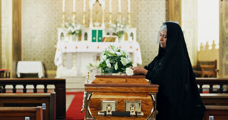 Sad, woman and coffin with rose at funeral for farewell, mourning death and goodbye at burial...