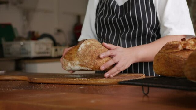 Artisan Sourdough Bread in Hand &ndash; Fresh from the Oven.