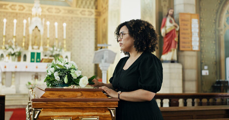 Thinking, woman and coffin at funeral for farewell, mourning death and goodbye at burial ceremony....