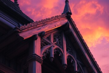 Ornate wooden architectural details against a vibrant sunset sky.