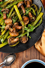 Baked asparagus spears with mushrooms.