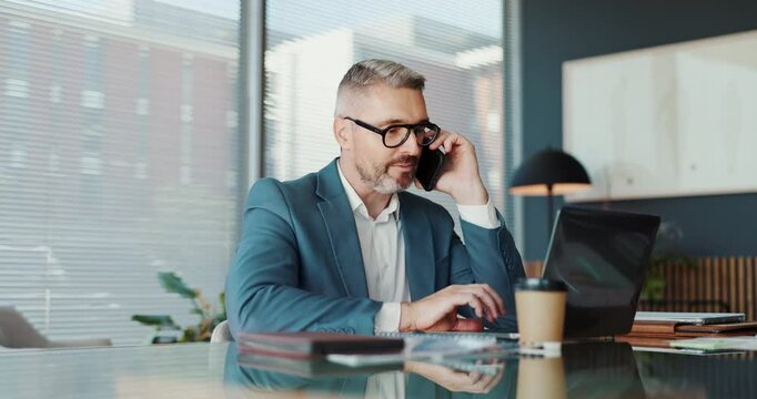 Office, businessman and phone call with laptop for discussion, accountant and audit report. Career, mature person and auditor with mobile for communication, financial research and investment review